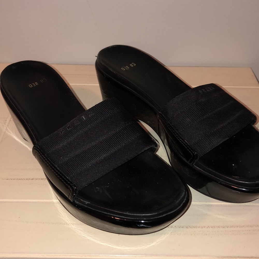 Prada black wedge slides.